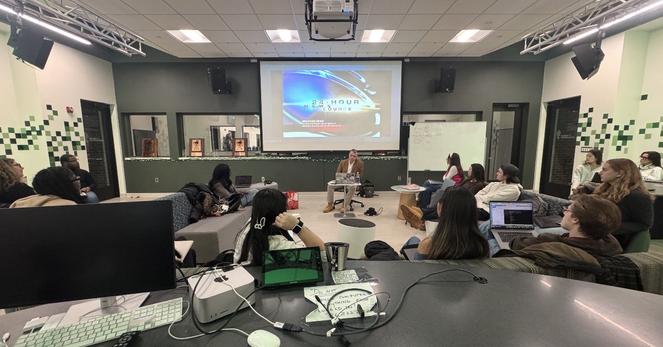 Andrew Gillfillan teaching journalism students at Michigan State University