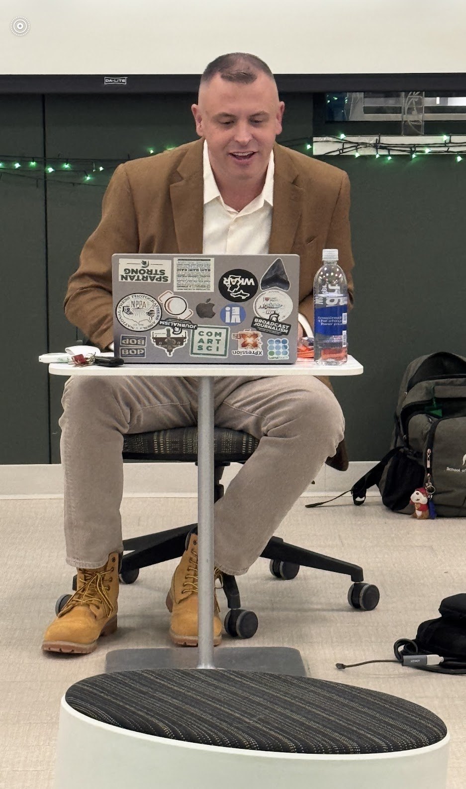 Andrew Gillfillan guest lecturing from his laptop in a Michigan State journalism classroom
